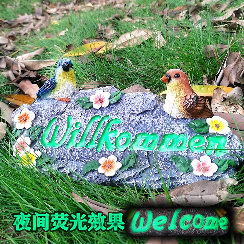 Garden resin welcomes colorful bird ornaments