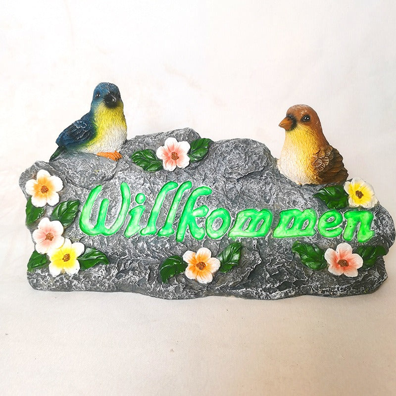 Garden resin welcomes colorful bird ornaments