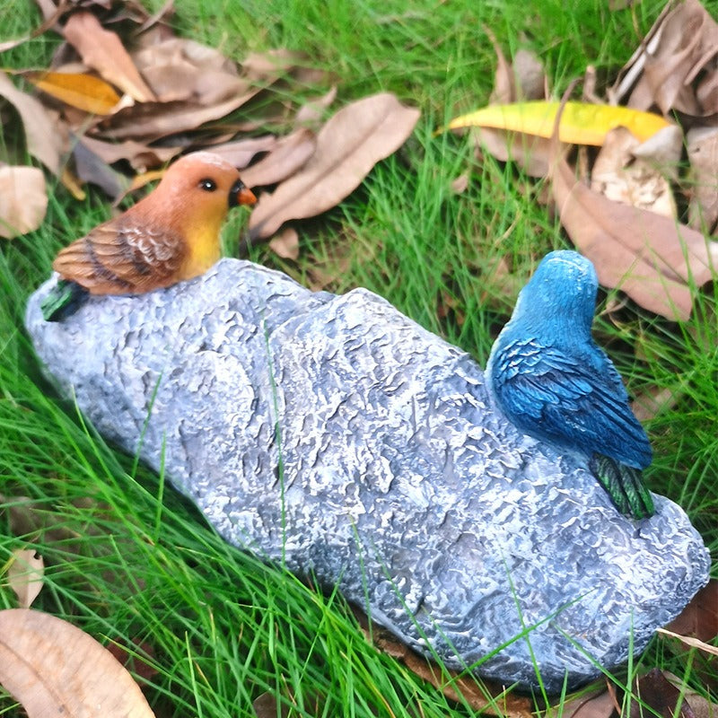 Garden resin welcomes colorful bird ornaments